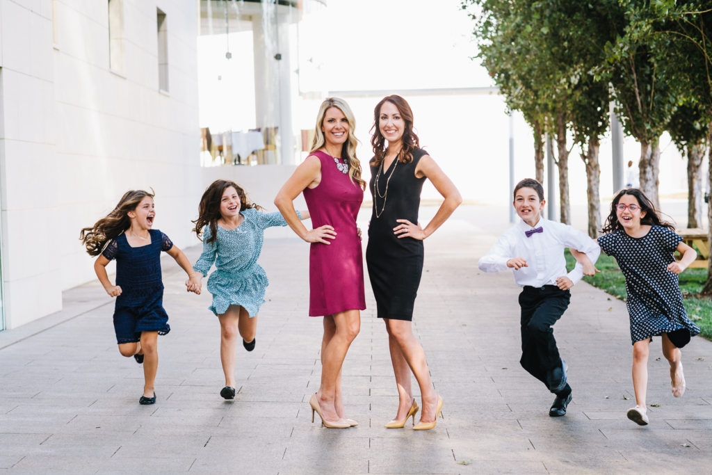 Erin Giglia and Laurie Row outside with their kids